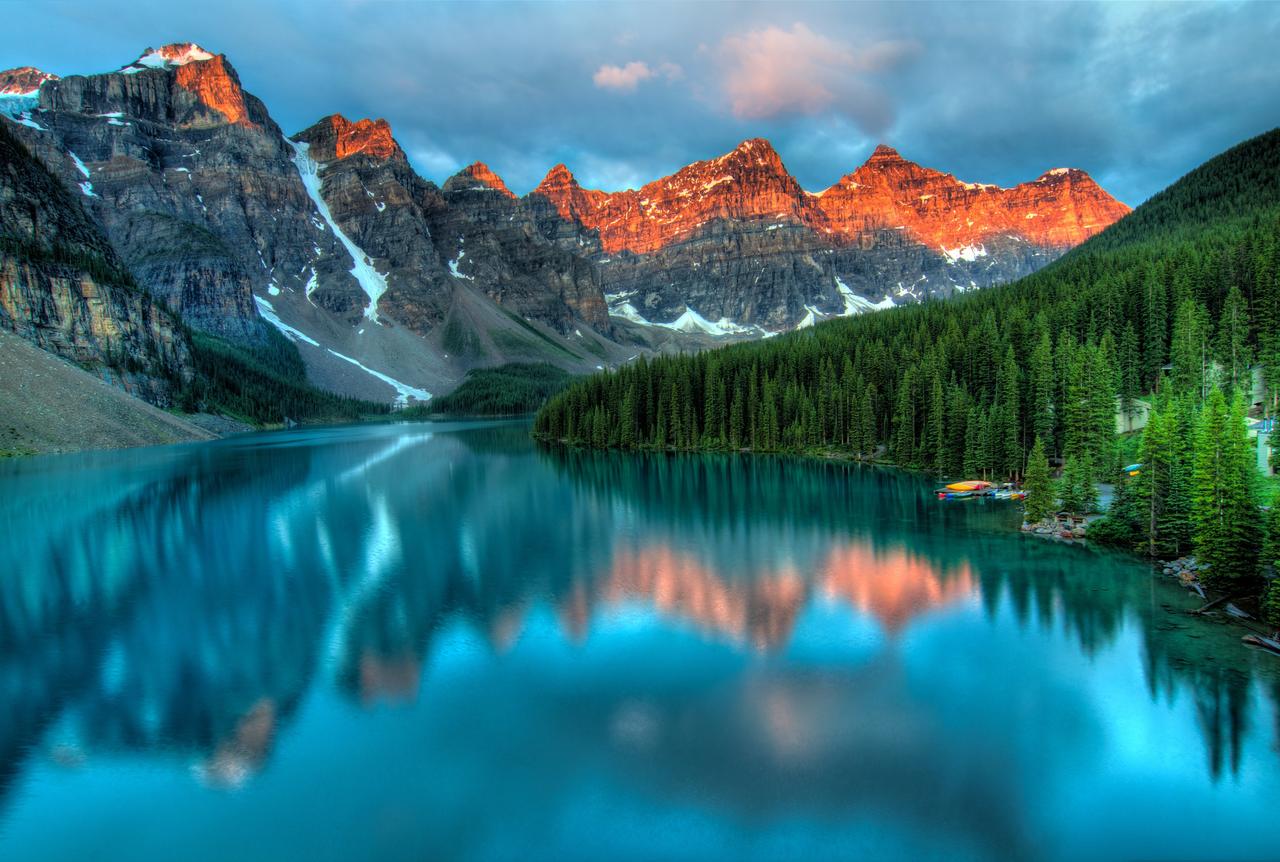 Scenic river flowing through Banff National Park surrounded by trees and mountains